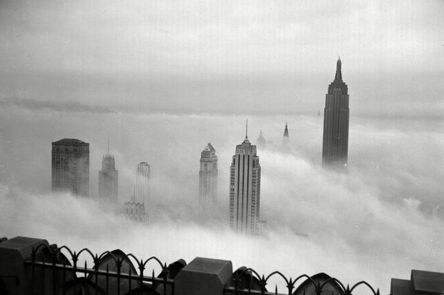 Taken from the 69th floor of the RCA building in Midtown. Seen through the clouds on the far right is the Empire State Building. August 18th, 1943.